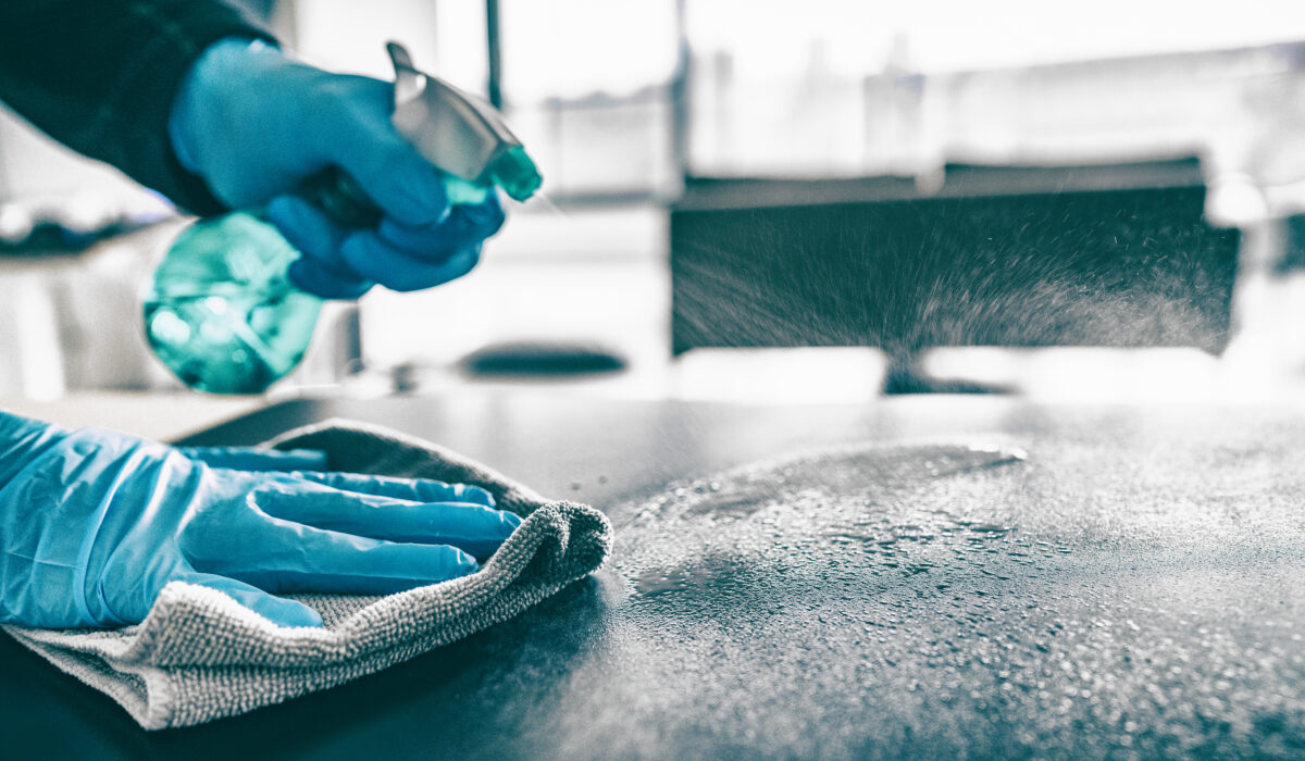 Cleaning,Home,Table,Sanitizing,Kitchen,Table,Surface,With,Disinfectant,Spray